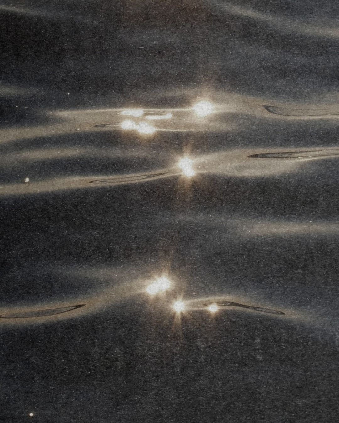Peaceful water reflection representing inner journey
